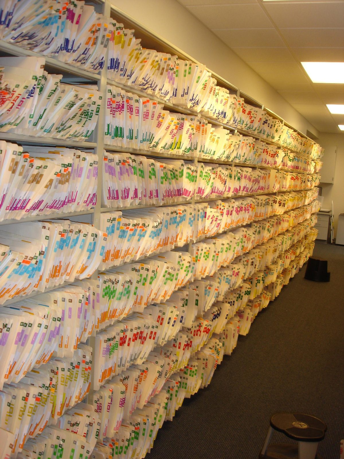 Shelves packed with labeled file folders
