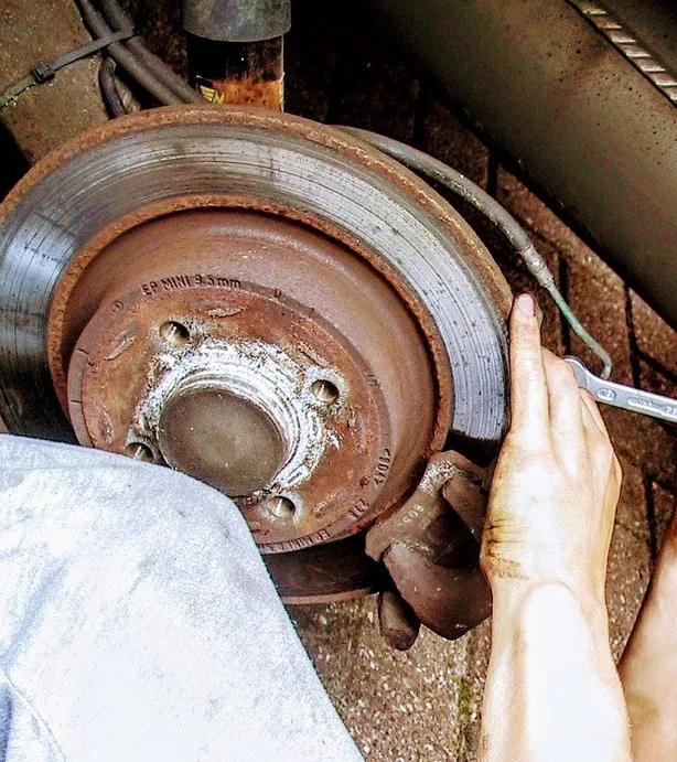 A brake rotor and a hand on the hub