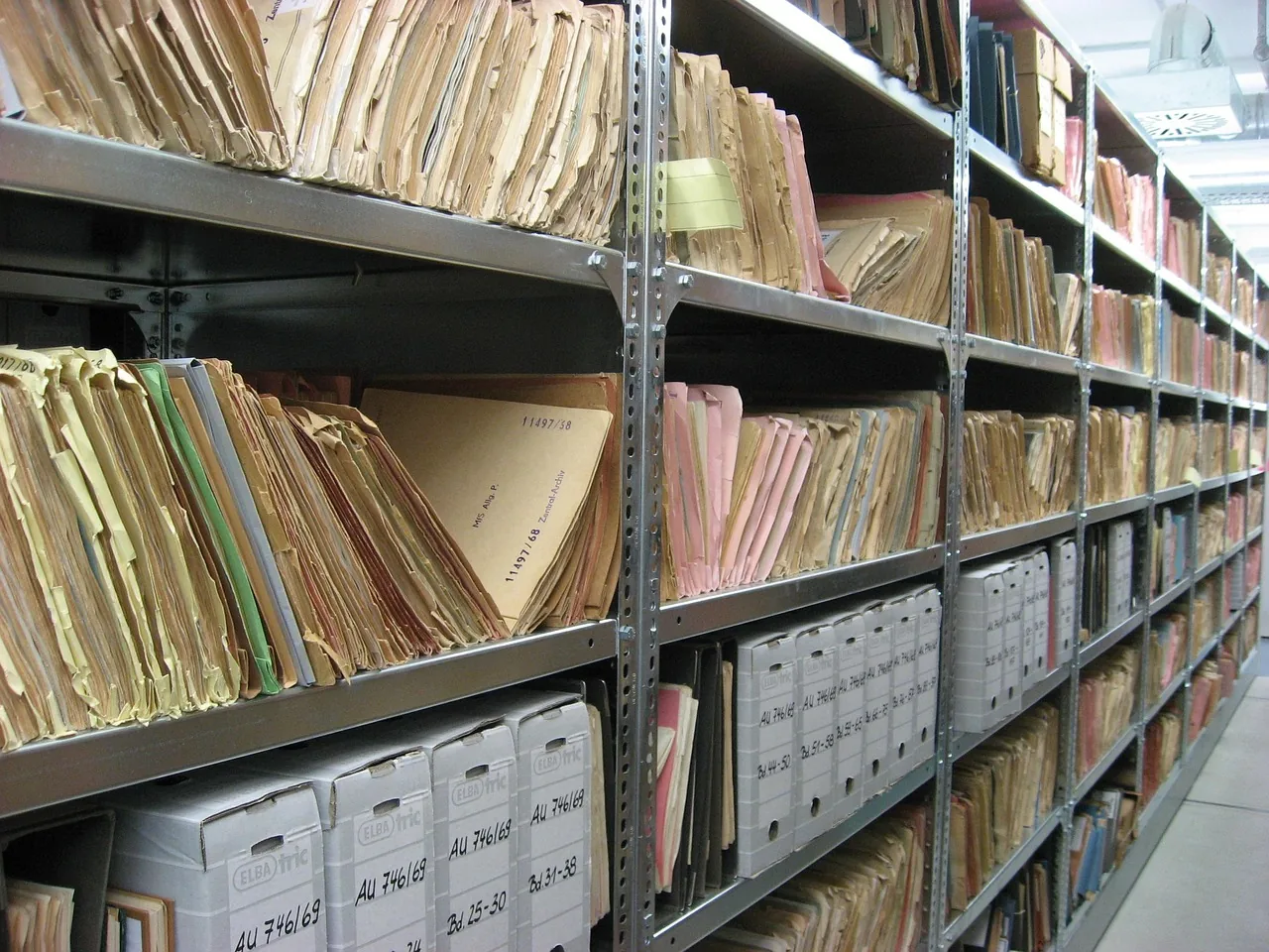 Archive shelves filled with paper file folders