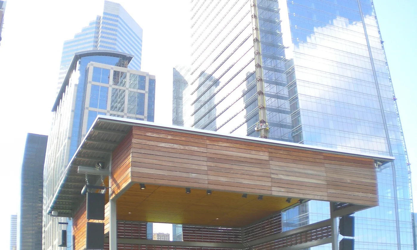 The stage at Discovery Green, with the downtown towers behind it