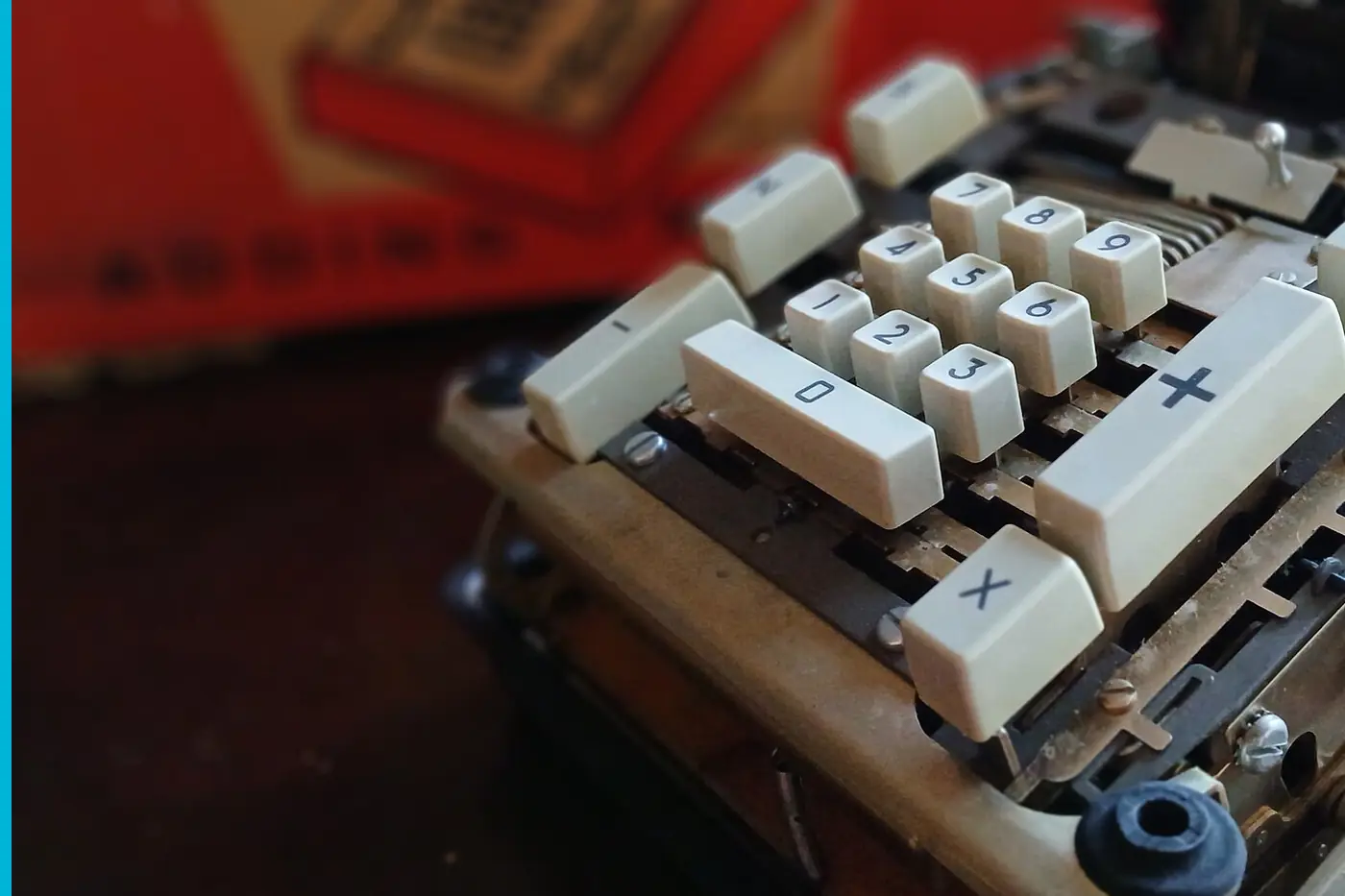 The inside of a Remington adding machine, gears beside the keys