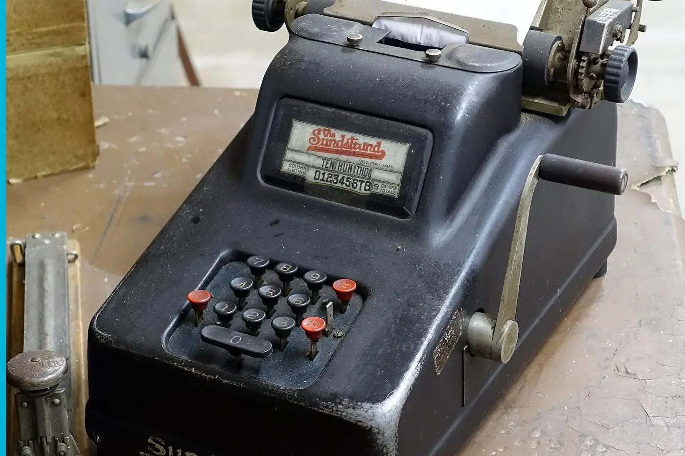 A Sundstrand adding machine, the keys and the crank on a work table