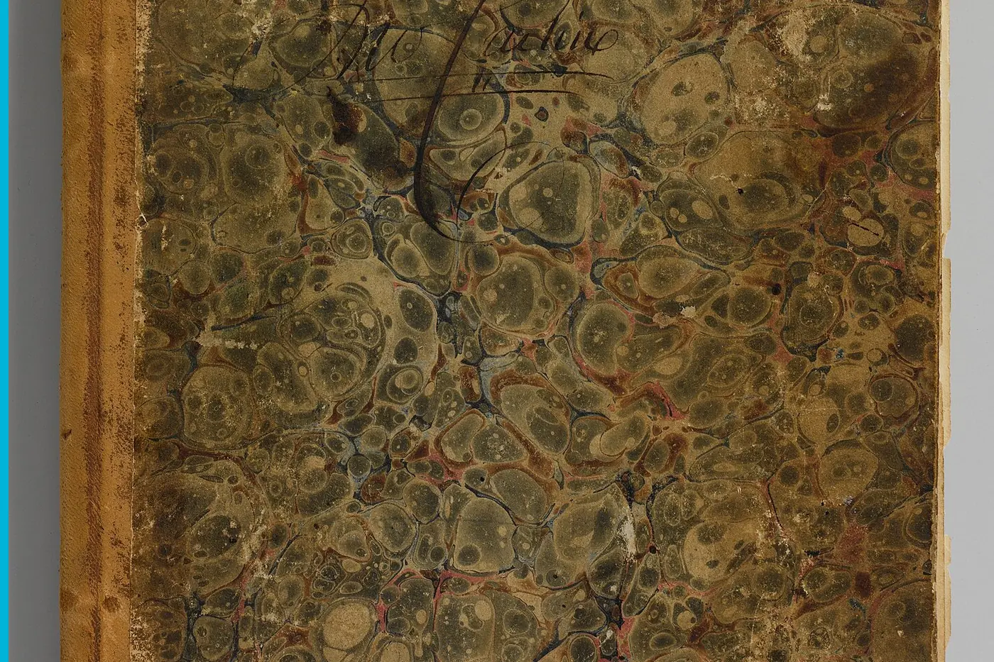 A closed account ledger, the cloth cover worn at the edges