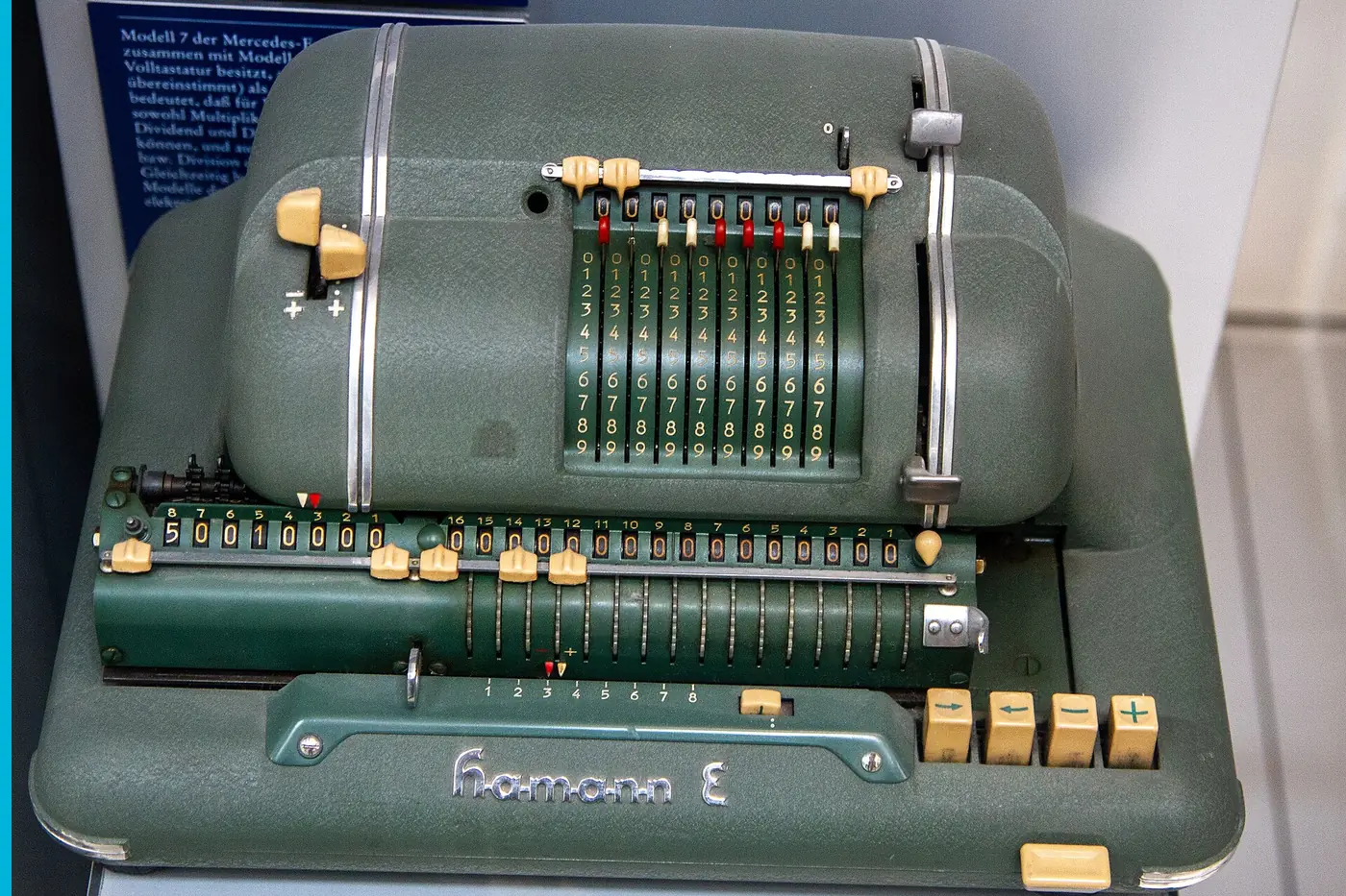 A green Hamann calculator, the digit wheels in a row