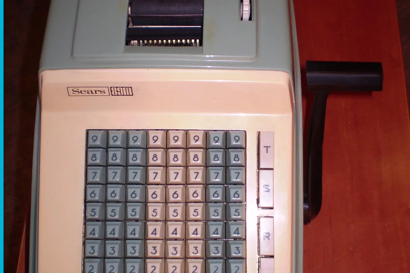 A Sears adding machine, the keys and the crank handle