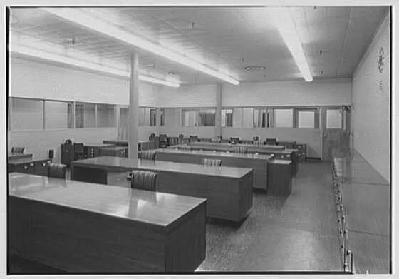 Rows of tables fill a bookkeeping office.