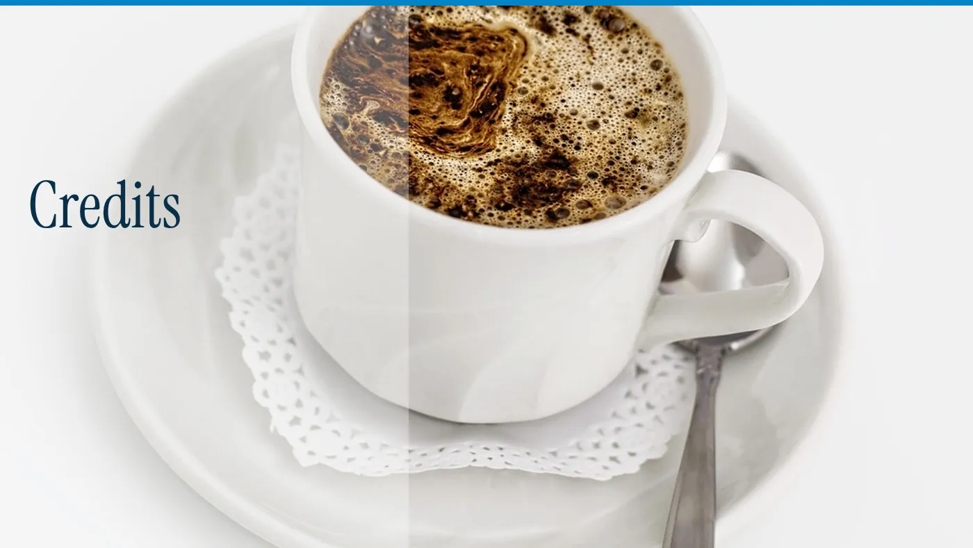 A white coffee cup on a saucer, with the word Credits in large type