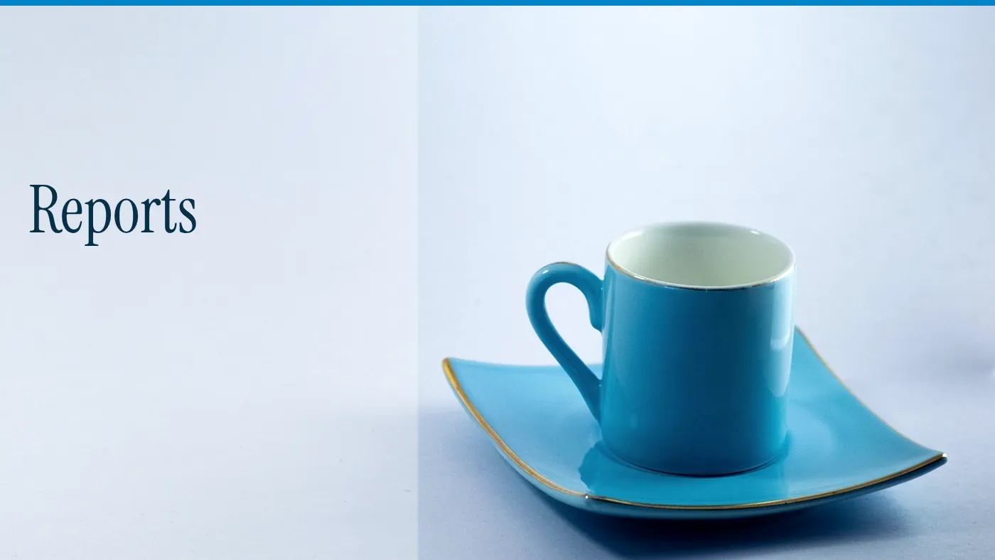 A blue cup on a pale ground, with the word Reports in large type