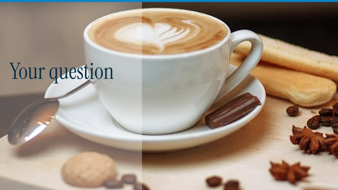A cup of coffee on a pale table, with the words Your question in large type