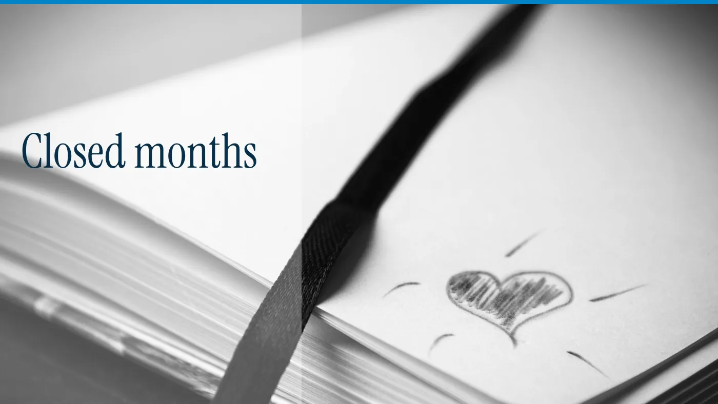 A notebook with a small heart drawn on the page, with the words Closed months in large type