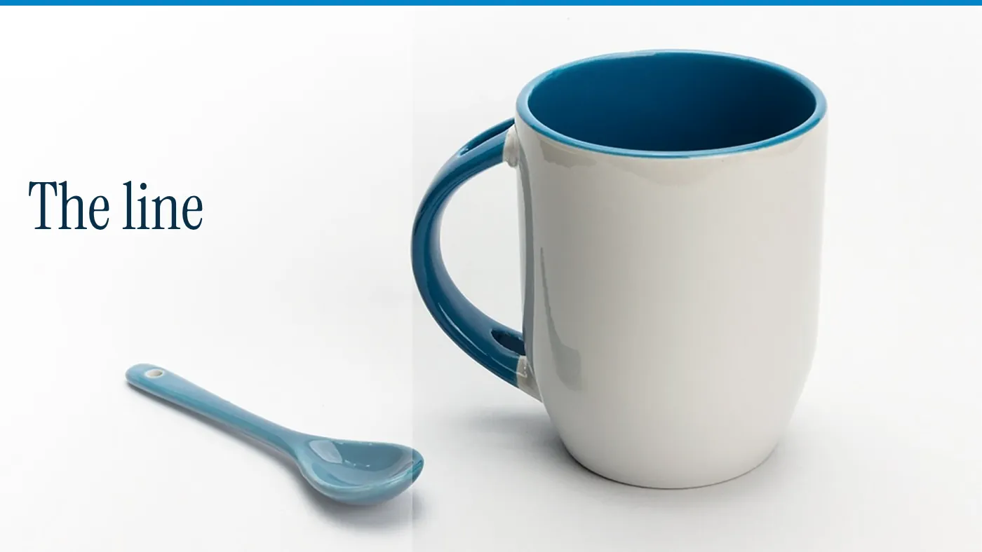 A white cup and a spoon, with the words The line in large type