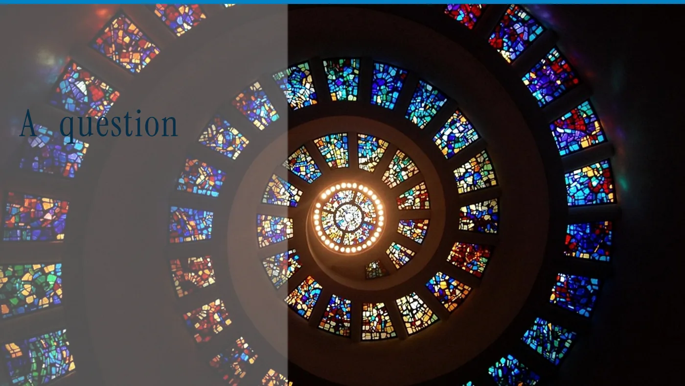 A spiral of stained glass, with the words A question in large type
