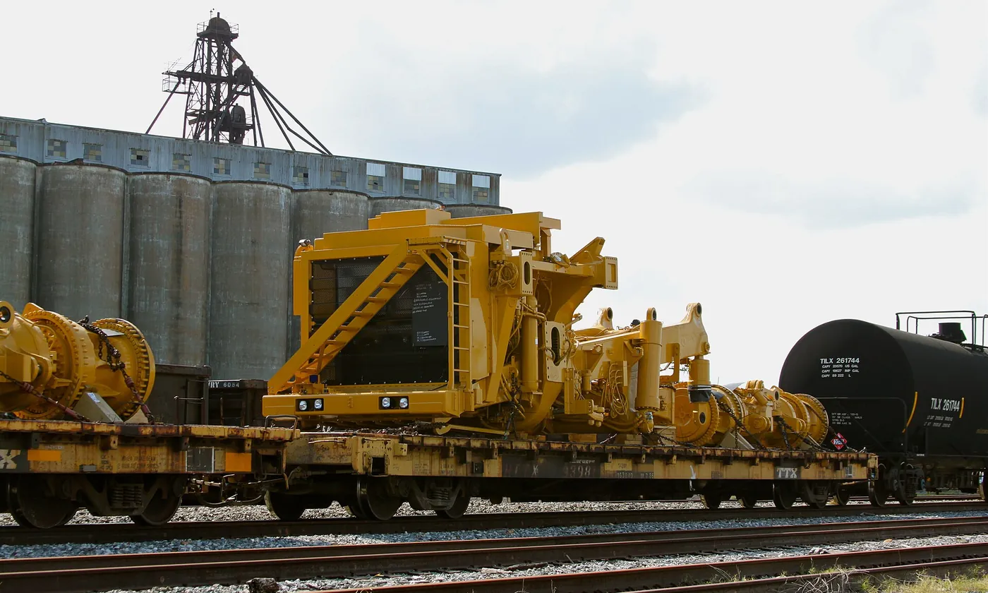 Heavy equipment on rail cars beside the grain elevator at the Port of Houston