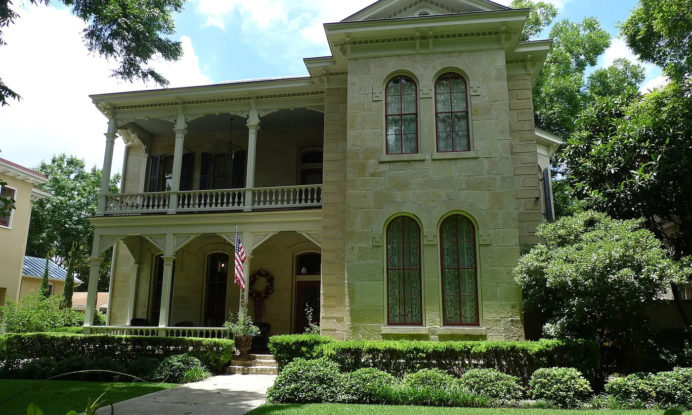 A limestone house with a deep porch in the King William district of San Antonio