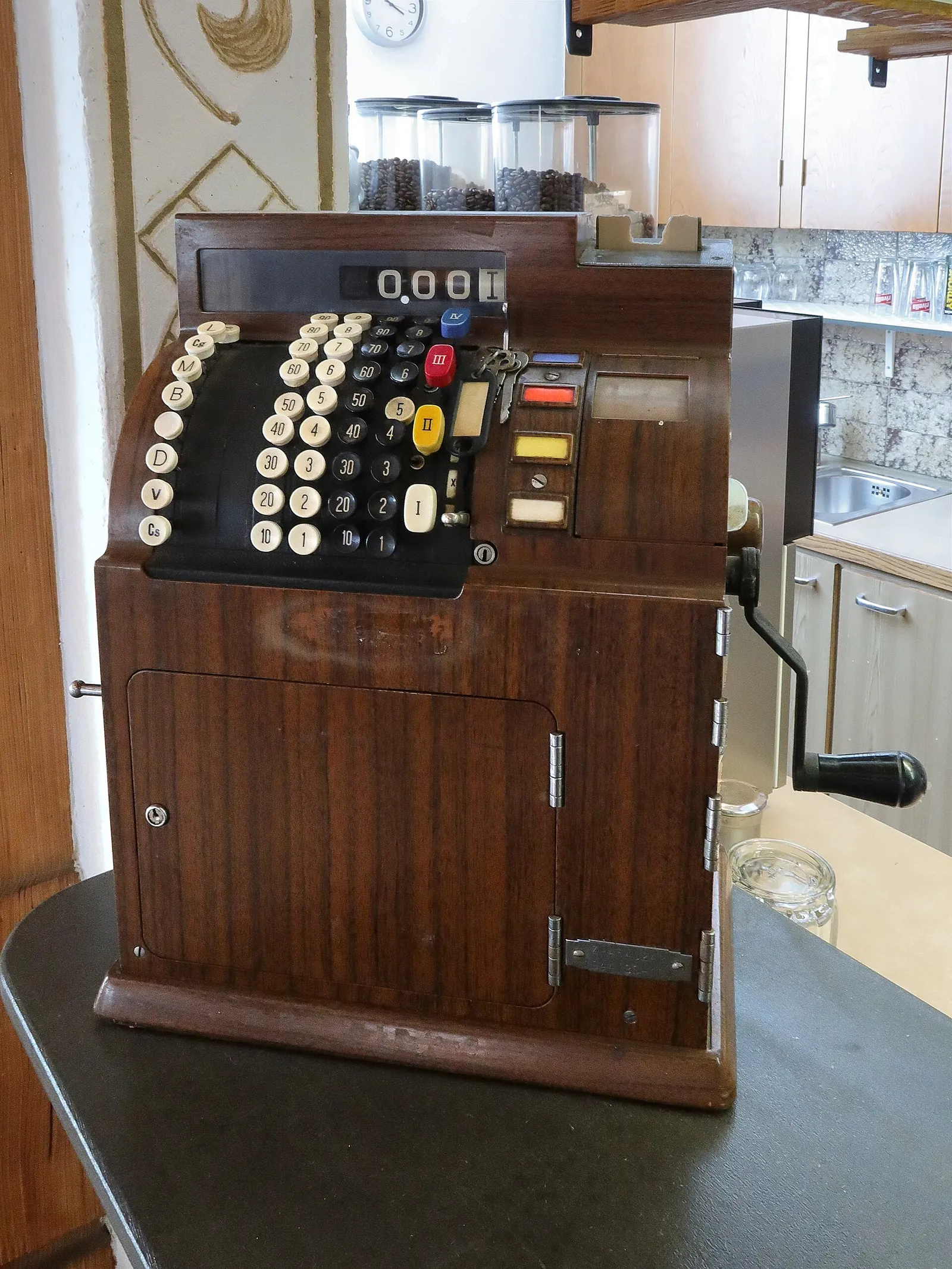 A 1944 National cash register with round number keys and a side crank