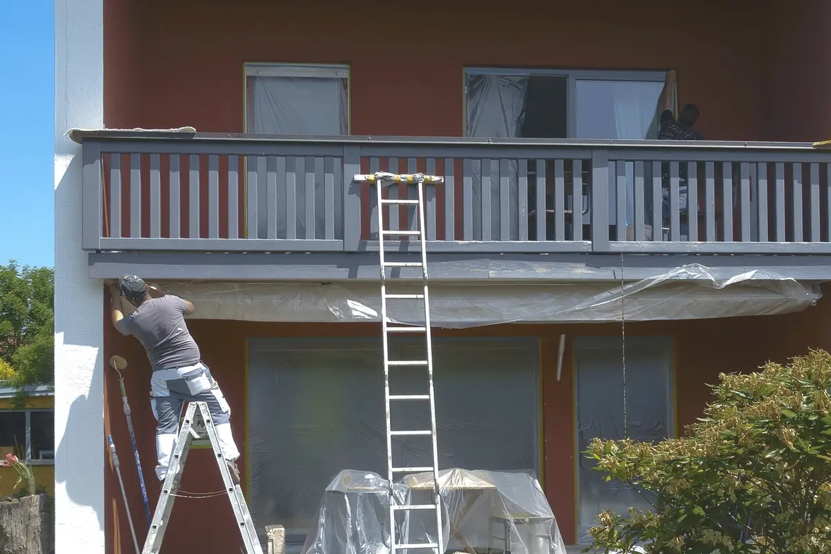 An extension ladder against the side of a house