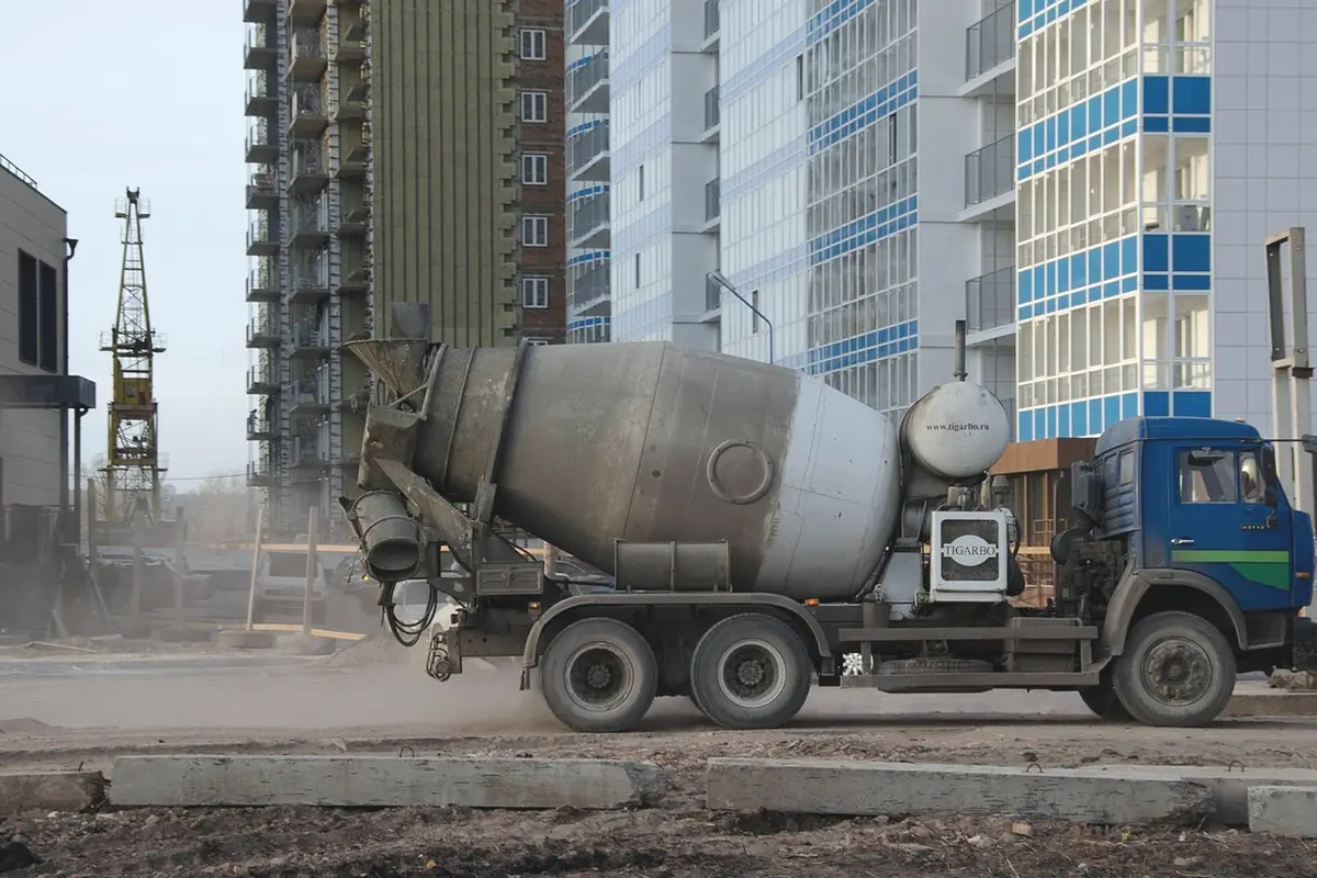 A cement mixer truck on a city street