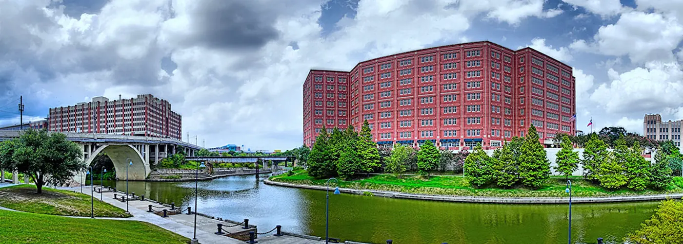 Bayou, brick warehouses, and a low bridge