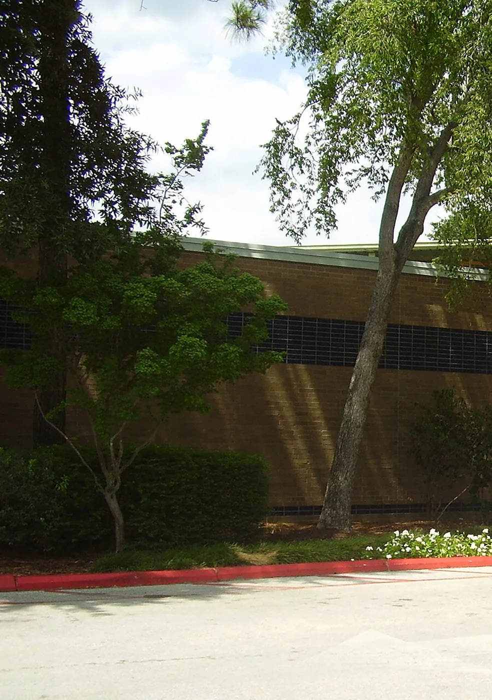 Brick wall and trees at a community center