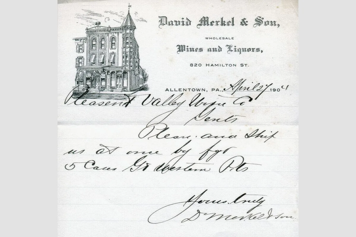 A wine merchant's letterhead and a handwritten note under the building.