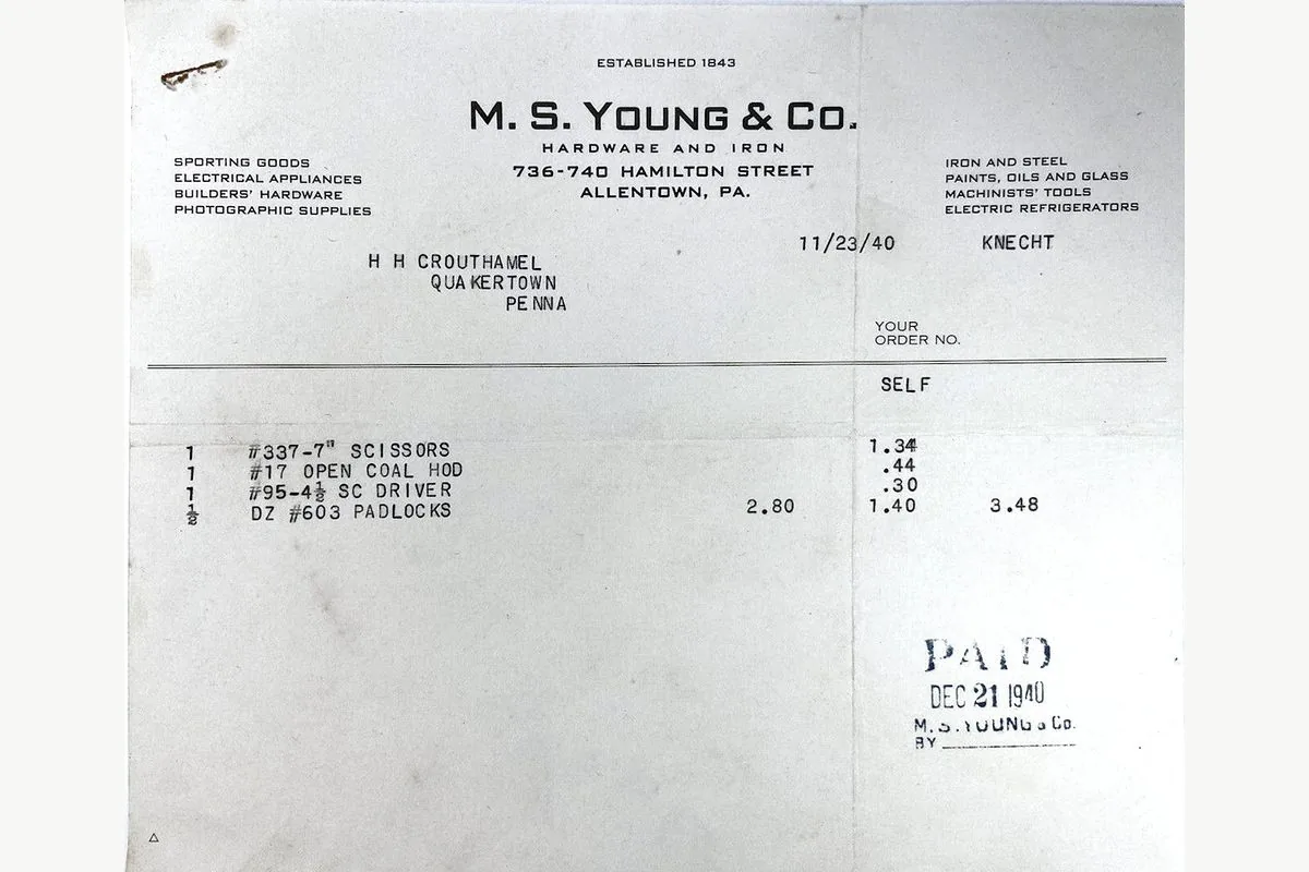 A hardware invoice with three lines, a total, and a paid mark.