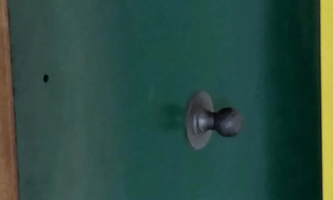 The face of a heavy vault door