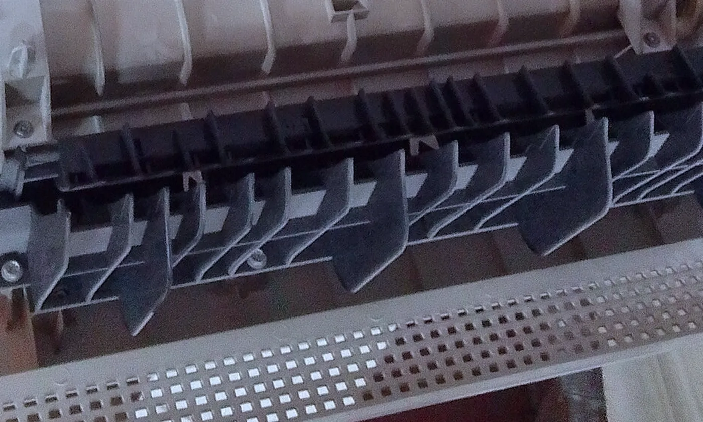 The rollers inside an open copier