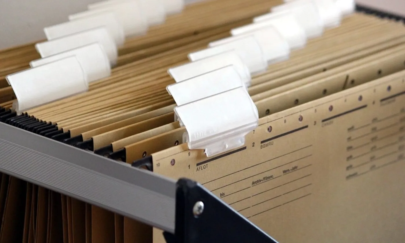 An open file drawer full of tabbed folders