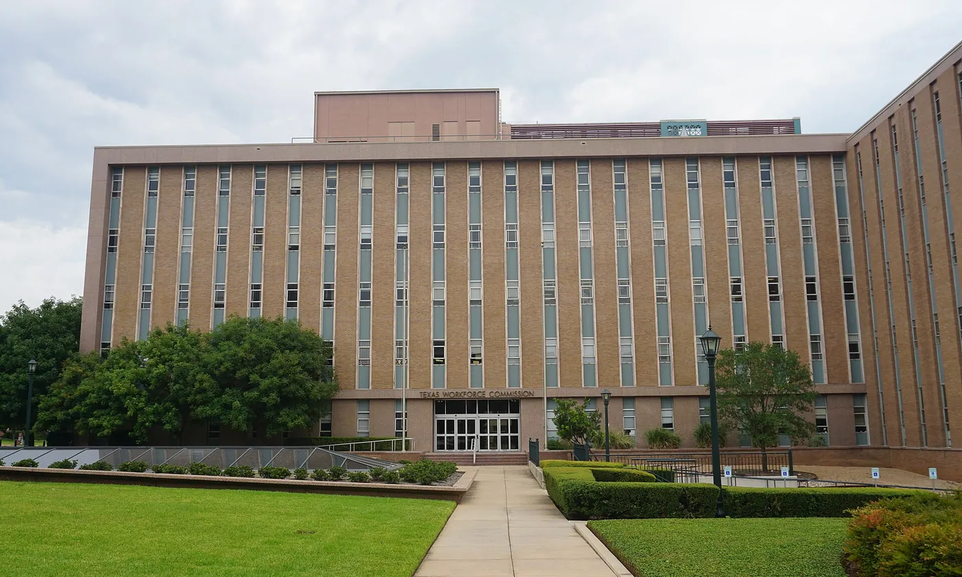 The Texas Workforce Commission building in Austin on a cloudy day