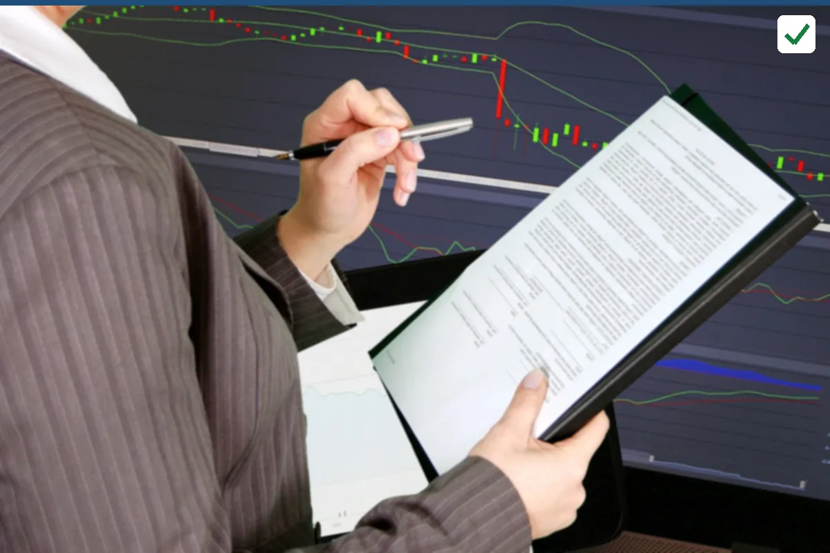 A person holding a tablet with a page of text and a pen