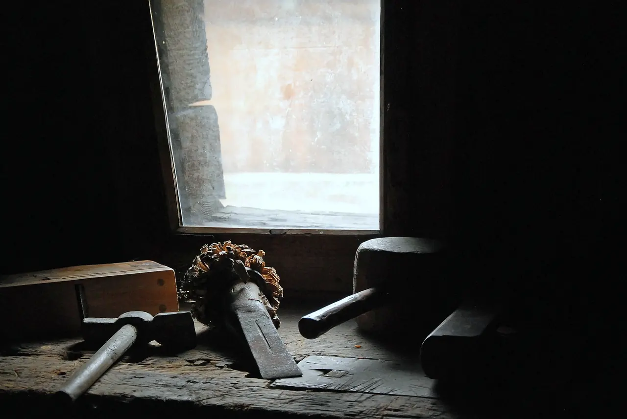 Hand tools laid on a workbench