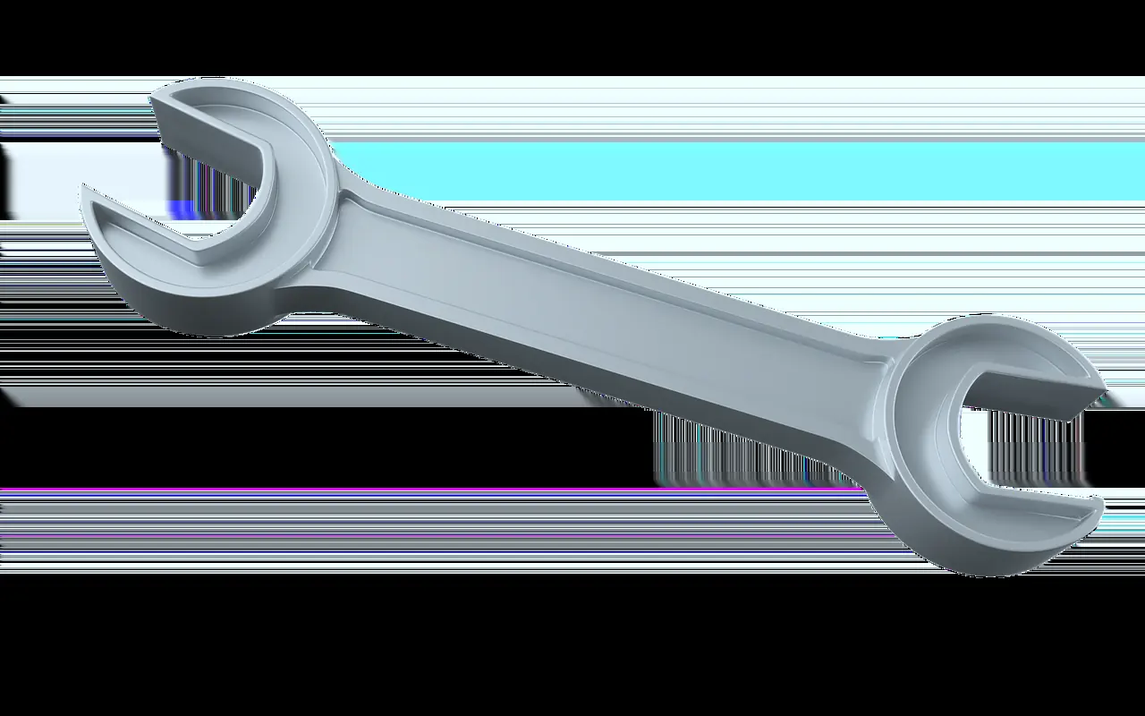 A metal wrench on a light ground