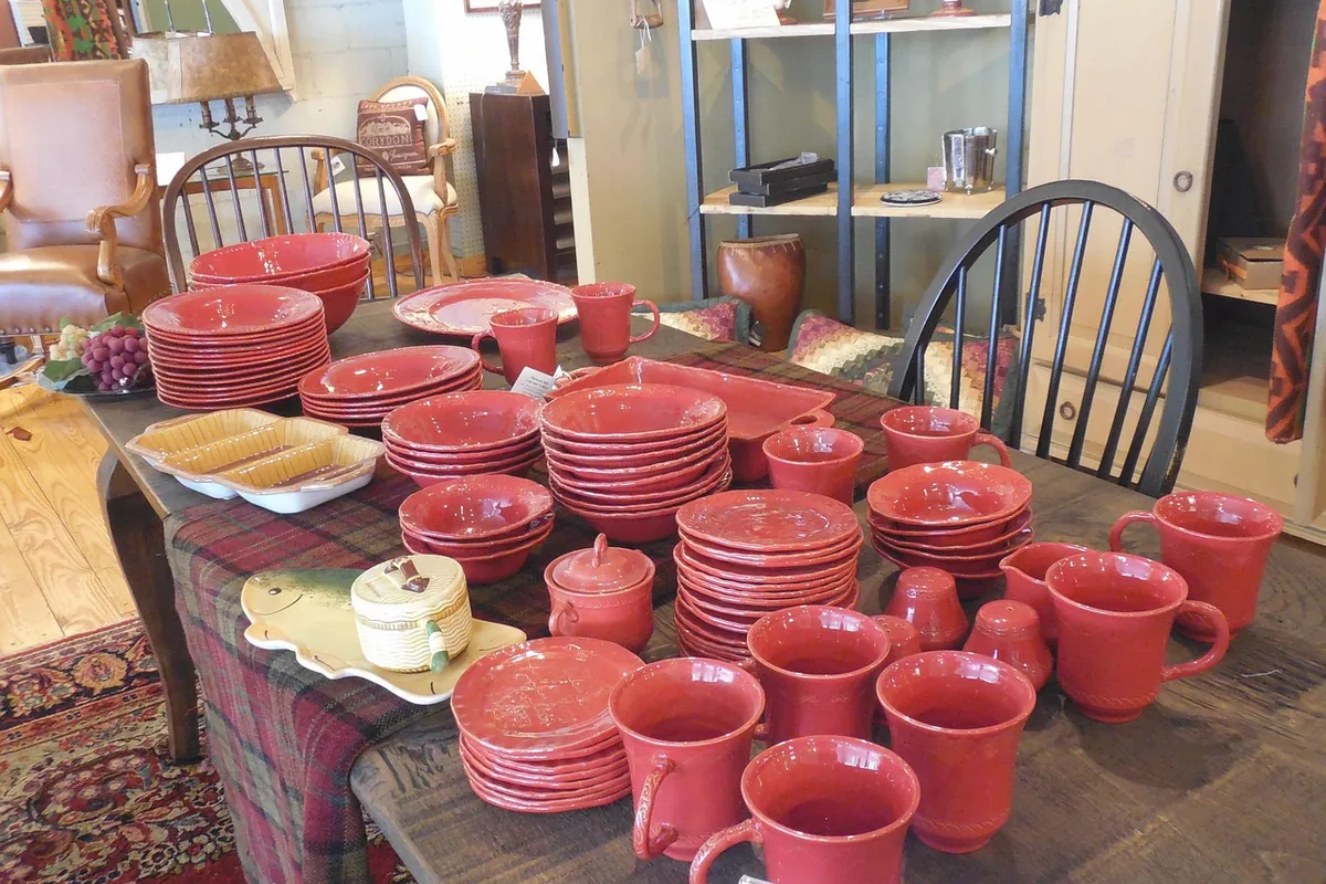 Red cups on a long table, with no logo readable.