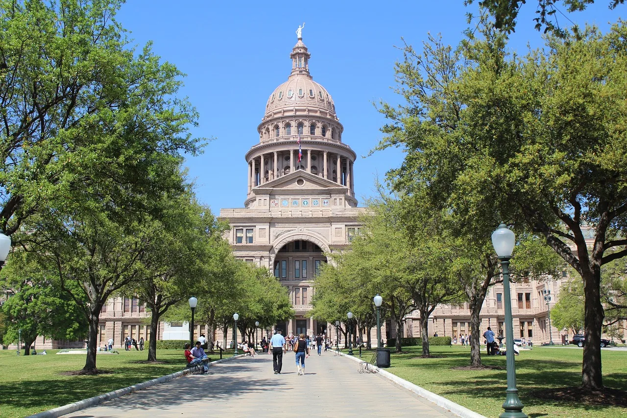 The Texas State Capitol in Austin, seen along the front walk on a clear day.