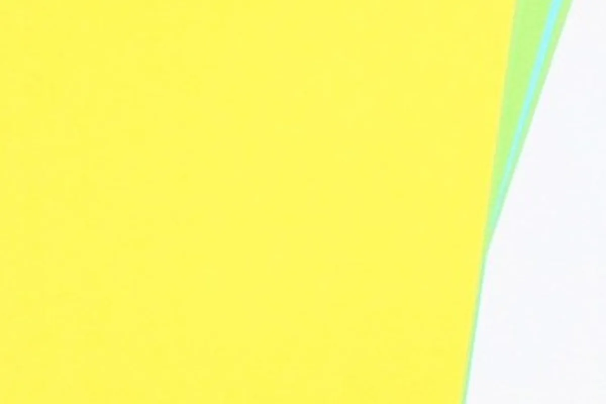 A plain yellow sheet of paper with a thin green edge.