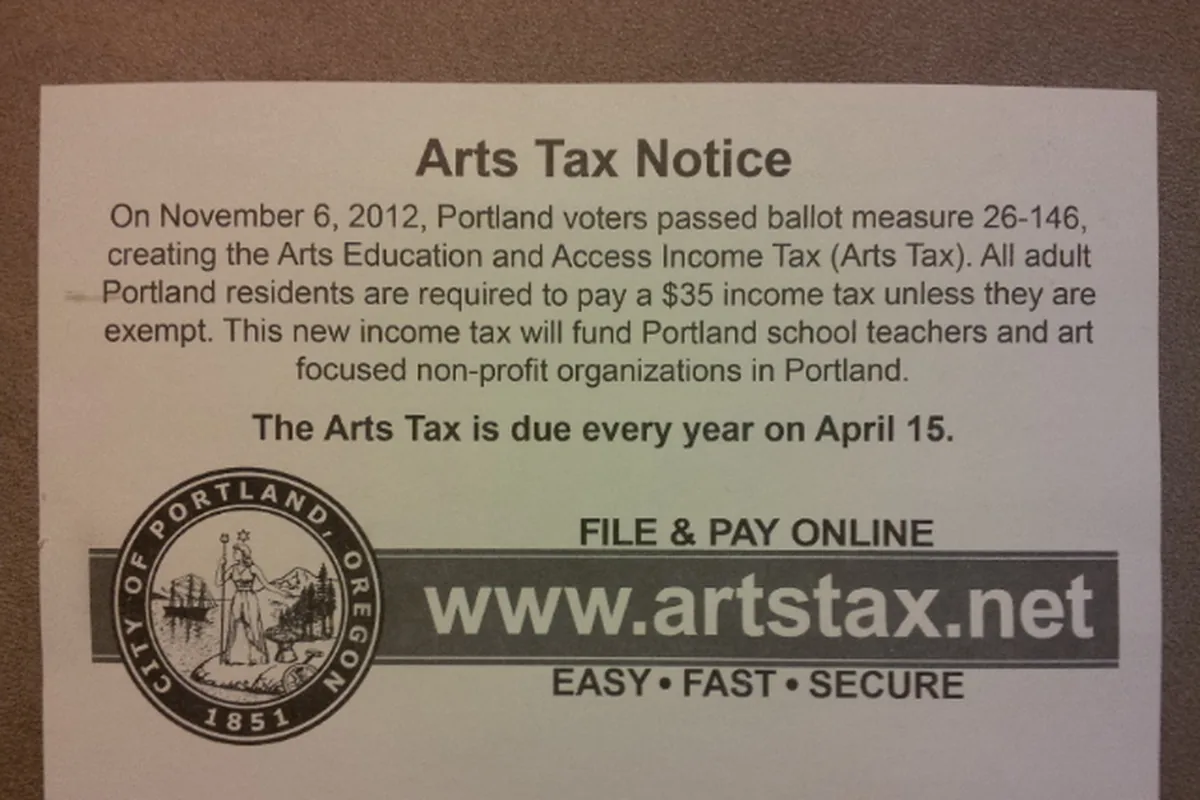 A printed tax notice on a table, with a November date and April 15 named as the day the tax is due.