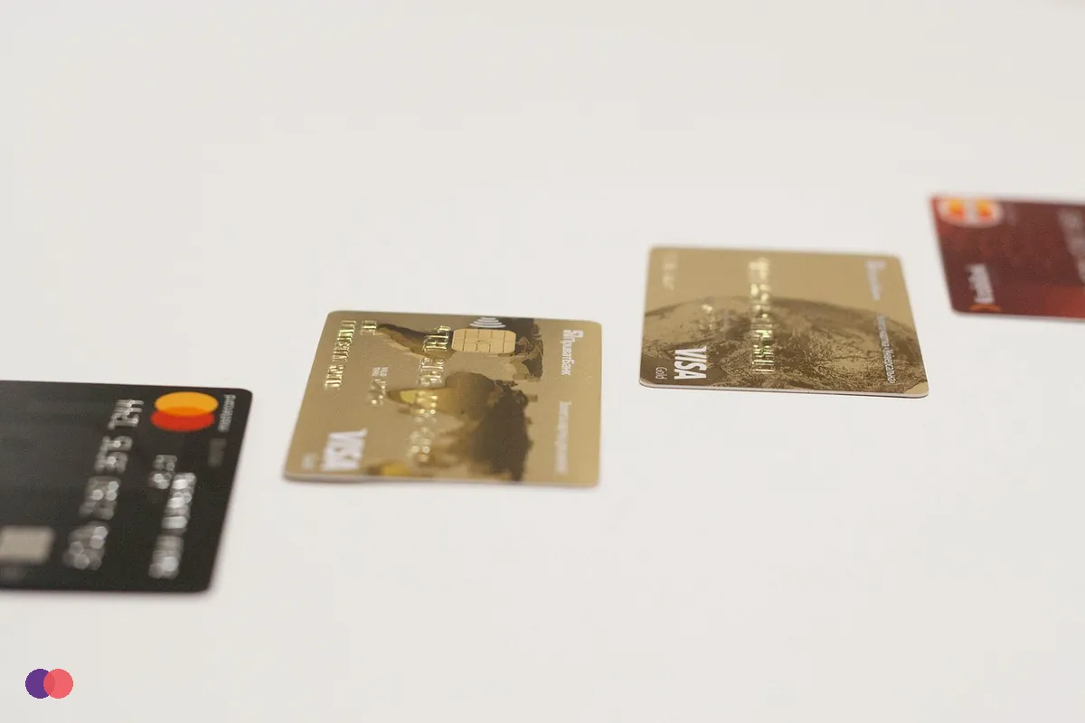 Bank cards laid apart on a white table with space between them